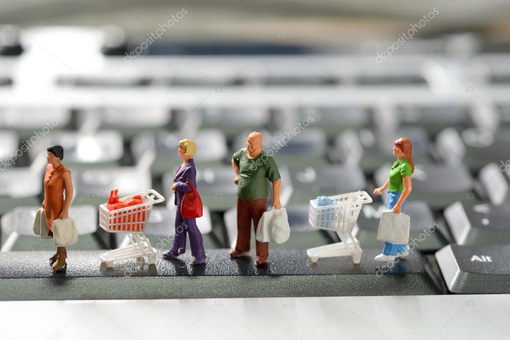 Miniature shoppers  with shopping cart
