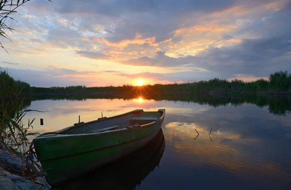 Fisherman boat at sunset — Stock Photo, Image
