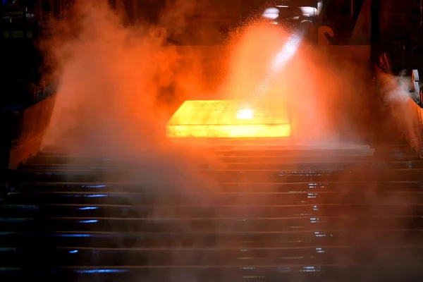 Hot steel on conveyor — Stock Photo, Image