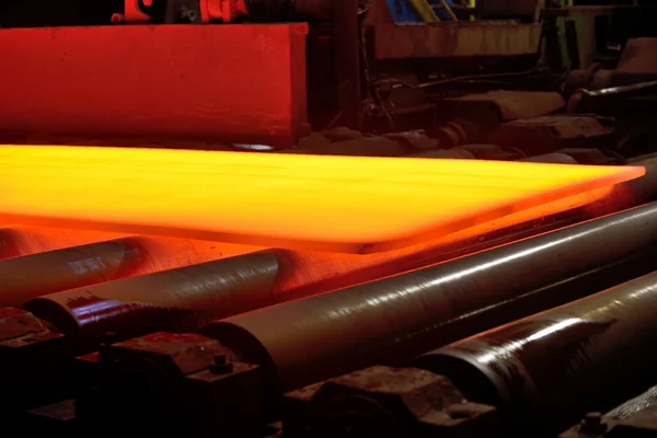 Hot steel on conveyor — Stock Photo, Image