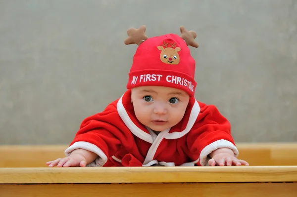 A baby in a Santa suit — Stock Photo, Image