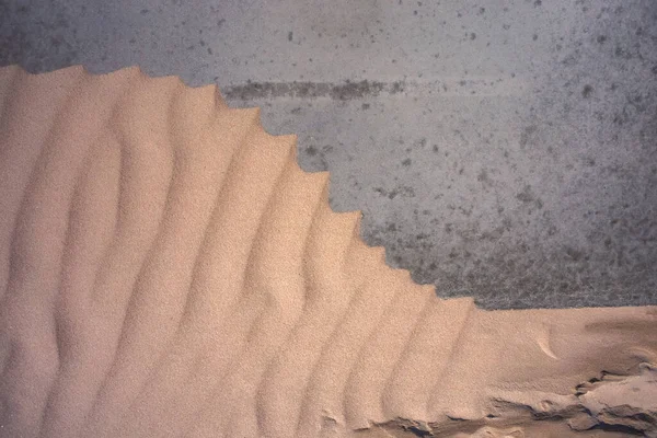Texturas de arena fondo en la playa sobre una base gris — Foto de Stock