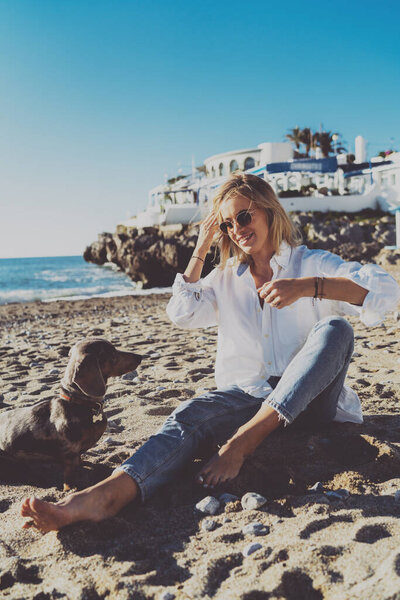 Faithful Dog Looking Admirably Owner Sitting Beach Cheerful Elegant Blonde Stock Picture