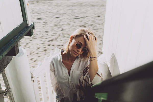 Attractive Blonde Caucasian Female Stylish Sunglasses Wearing White Shirt Blanket Stock Picture