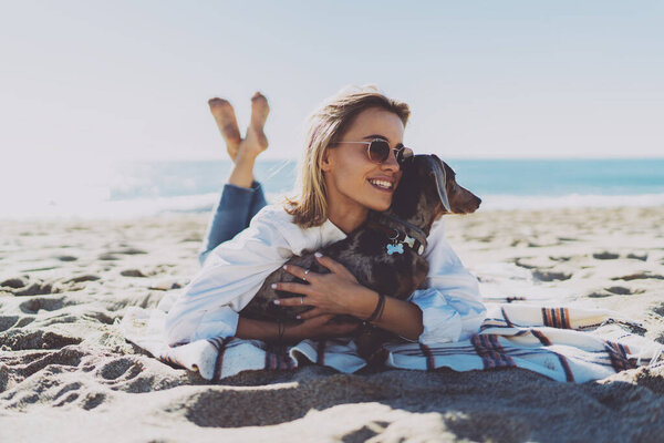 Cheerful Young Woman Casual Clothes Stroking Cuddling Her Lovely Dog Stock Image