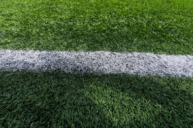 Futbol sahasında yapay çimenler. Yakın plan. Geçmişi. Doku.