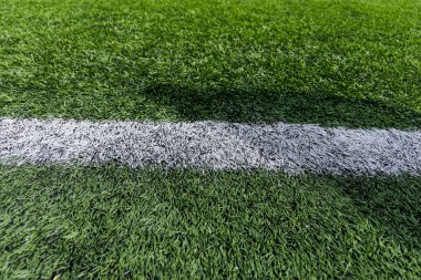 Futbol sahasında yapay çimenler. Yakın plan. Geçmişi. Doku.