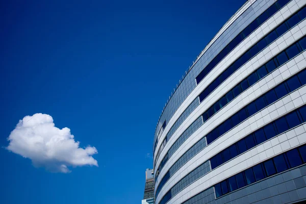 The new building of the sports complex against the blue sky. Glass windows and sky. — ストック写真