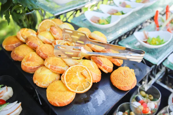 Minsk. Belarus - 18.06.2021 - Cookies with an orange. Buffet at a golf tournament in Minsk. — стокове фото