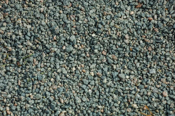 Фон, маленькие камни серого цвета на земле — стоковое фото