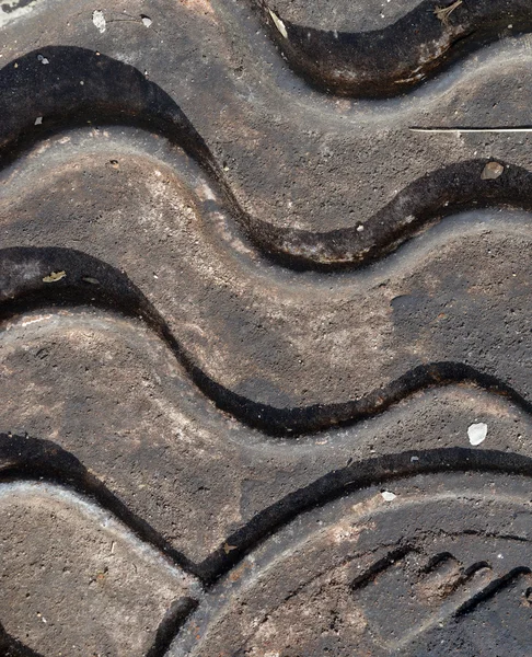 Close-up of the metal manhole cover in the sunshine. — Stock Photo, Image