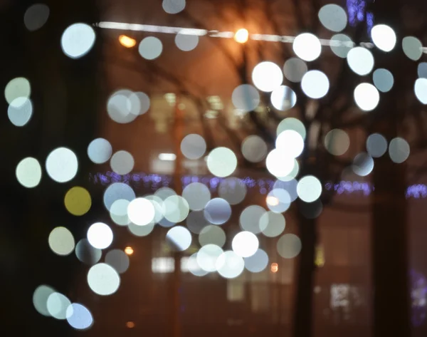 City lights in the background with blurring light — Stock Photo, Image