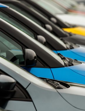 Car wingmirrors on display on dealers forecourt