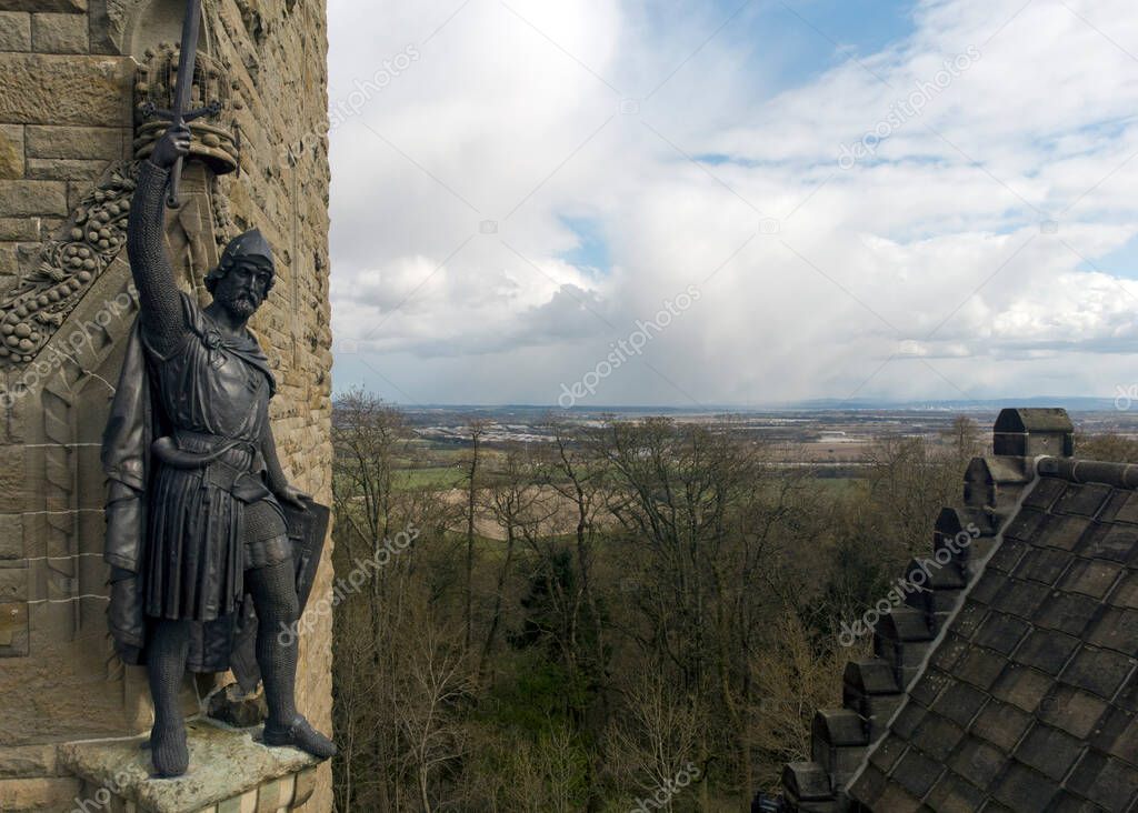 William Wallace statue stands proudly over Stirling. The National Wallace Monument is a tower standing on a hilltop overlooking Stirling in Scotland.It commemorates Sir William Wallace, a 13th and 14th-century Scottish hero.