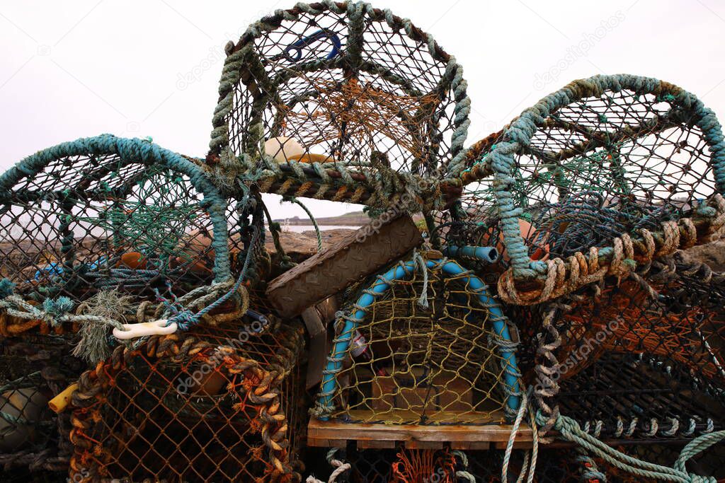 A lobster trap or lobster pot is a portable trap that traps lobsters or crayfish and is used in lobster fishing. In Scotland (chiefly in the north), the word creel is used to refer to a device used to catch lobsters and other crustaceans.