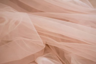 Yumuşak bej kumaş soyut arkaplan ve bulanık yakın plan