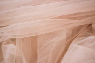 Yumuşak bej kumaş soyut arkaplan ve bulanık yakın plan