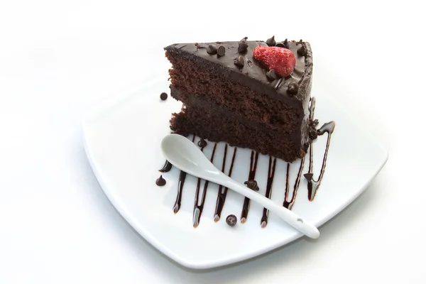 Slice of chocolate layer cake with  strawberries and chocolate s — Stock Photo, Image