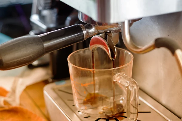 Closeup of espresso pouring from coffee machine ,Coffee making p