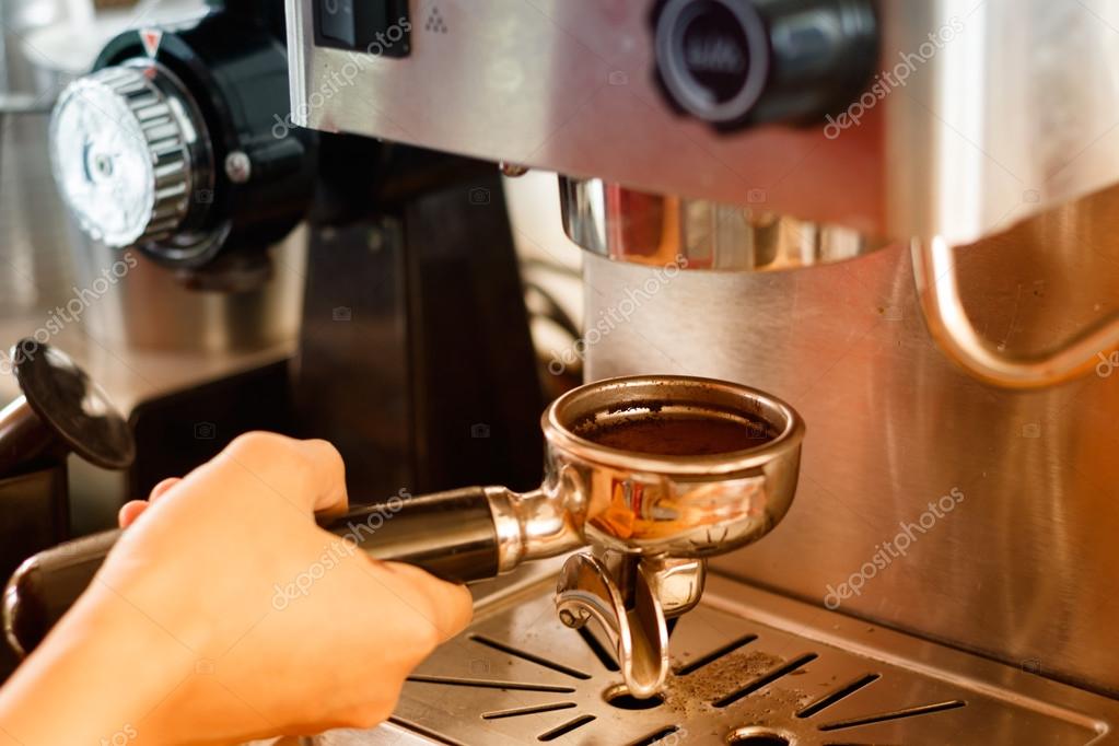 Barista preparing coffee in a cafe. coffee making process from a