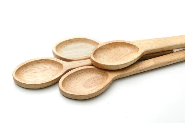 Quattro cucchiai di legno isolati su bianco . — Foto Stock