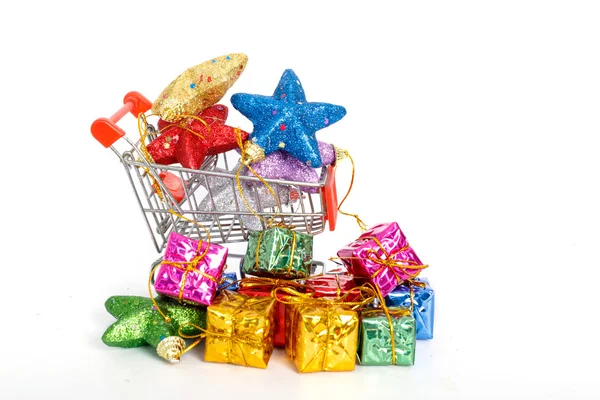 Colorful gifts box in supermarket shopping cart,concept of buy s — Stock Photo, Image