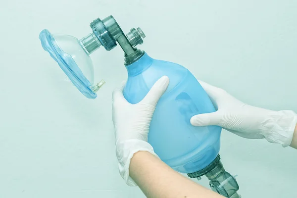 Doctor holding breathing bag (Ambu) and face mask — Stock Photo, Image