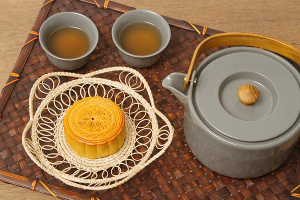 Chinese moon cake with tea ceremony on wooden background — Stock Photo, Image