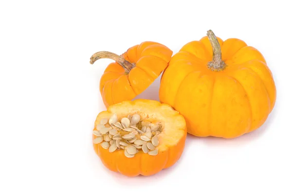 Pumpkin seeds and fresh pumpkin slices — Stock Photo, Image