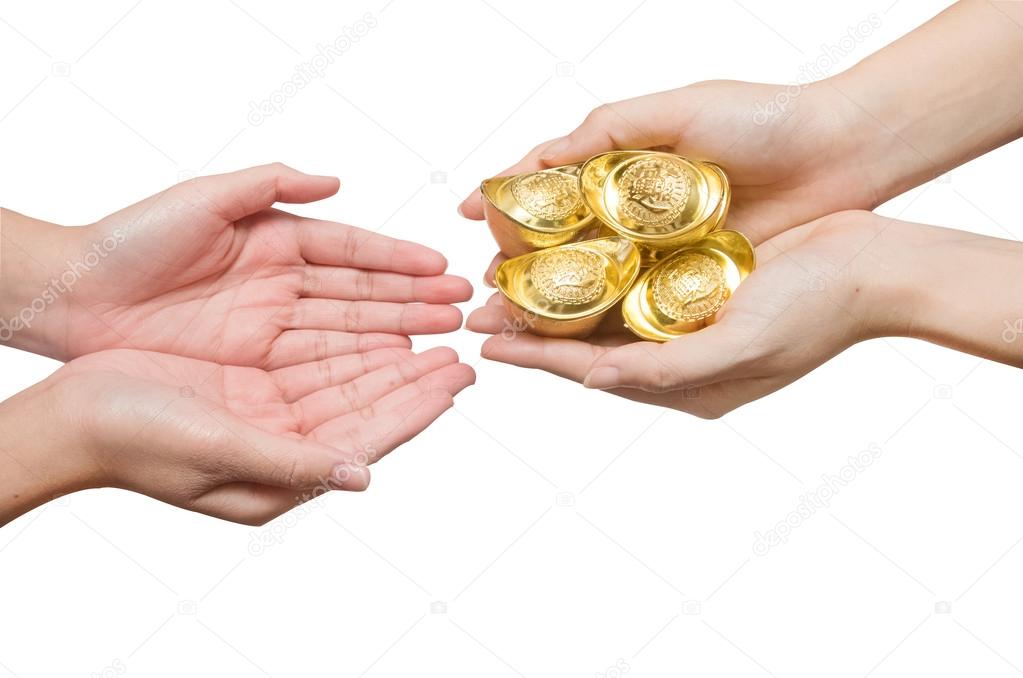Hand giving chinese gold ingots