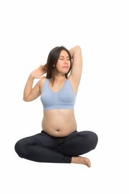 Doğum öncesi çalışmaları. Güzel bir hamile kadın egzersiz