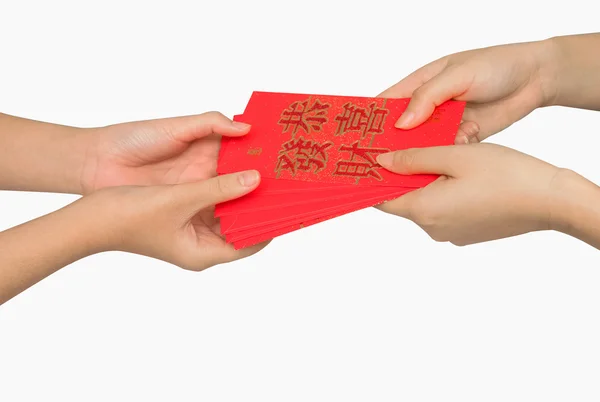 Hand som håller ang pow eller rött paket pengar gåva. Kinesiska nyåret — Stockfoto