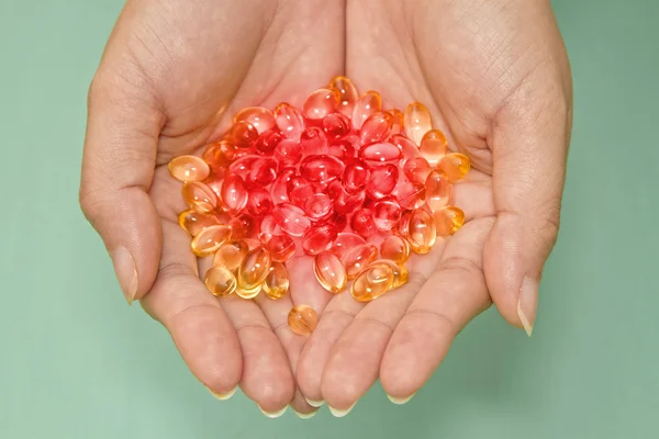 Colorful medicine in hands — Stock Photo, Image
