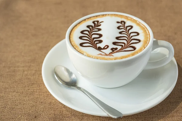 Coffee latte art in coffee shop — Stock Photo, Image