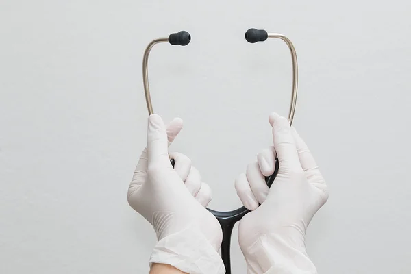 Doctor hands holding a stethoscope, medical concept — Stock Photo, Image