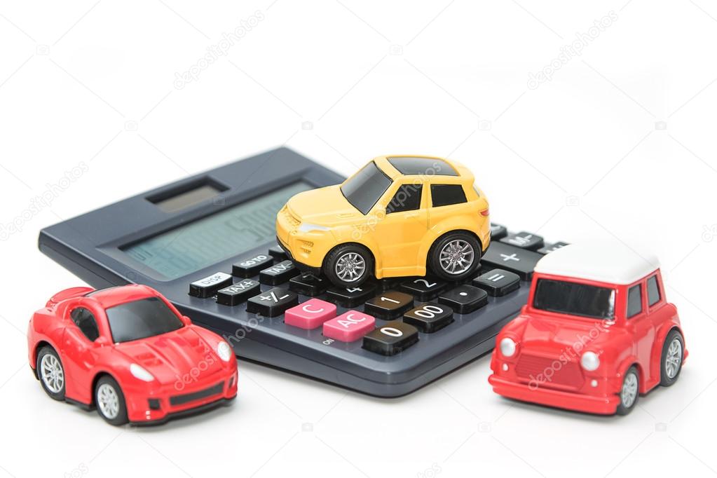 Toy car and calculator. Concept for finance and  insurance