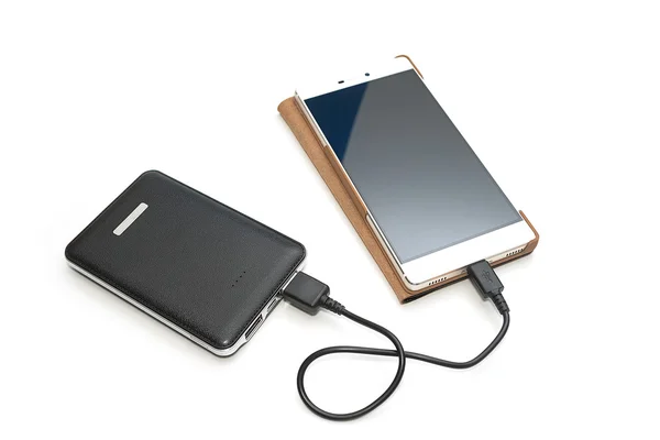 Recarregando tablet telefone inteligente do banco de energia — Fotografia de Stock