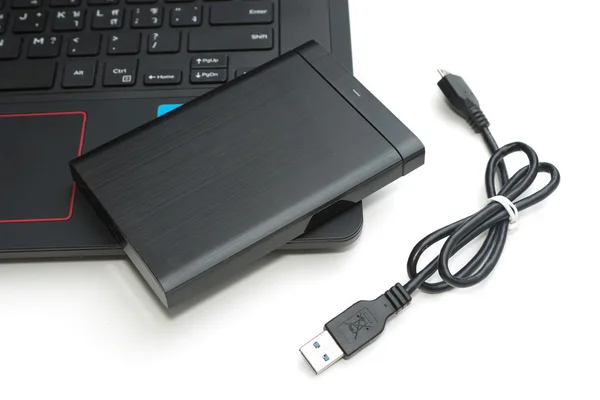 External hard disk connect to computer notebook on white. — Stock Photo, Image