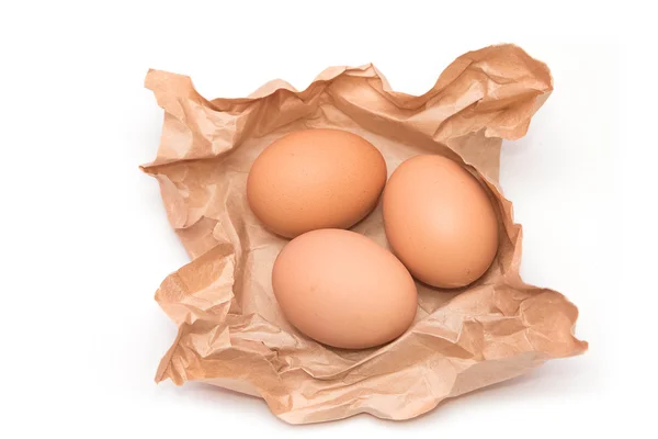 Group of eggs on brown paper — Stock Photo, Image