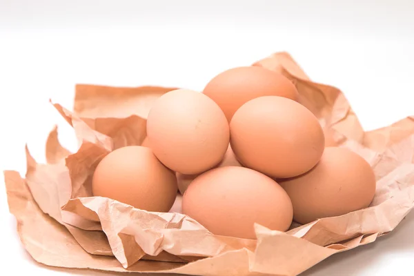 Group of eggs on brown paper — Stock Photo, Image