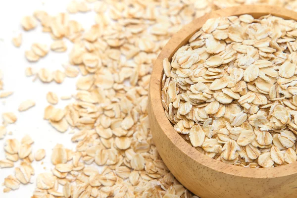 Closeup oats in bowl, on oats background. — Stock Photo, Image