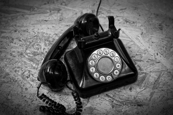 Old telephone on wood background. — Stock Photo, Image