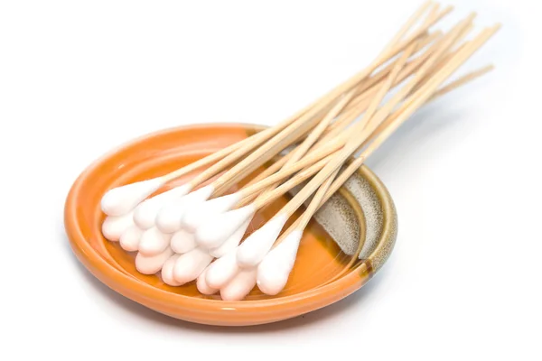 Group of cotton sticks in plate on white background — Stock Photo, Image