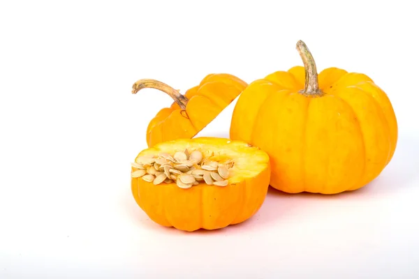 Calabazas y semillas sobre fondo blanco — Foto de Stock