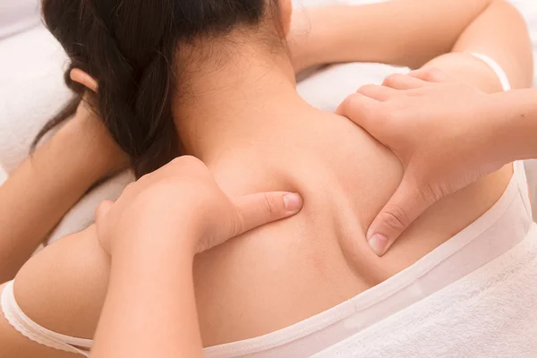 Closeup beautiful asian woman having deep massage — Stock Photo, Image