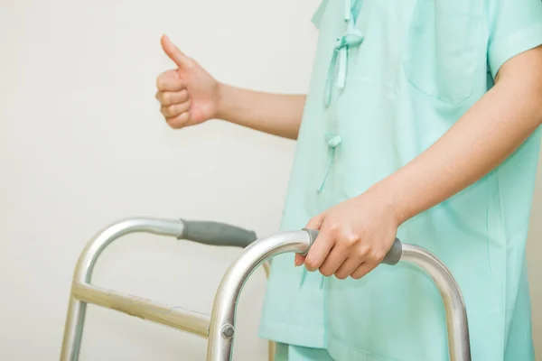 Patient woman rehab to walk with walking frame — Stock Photo, Image