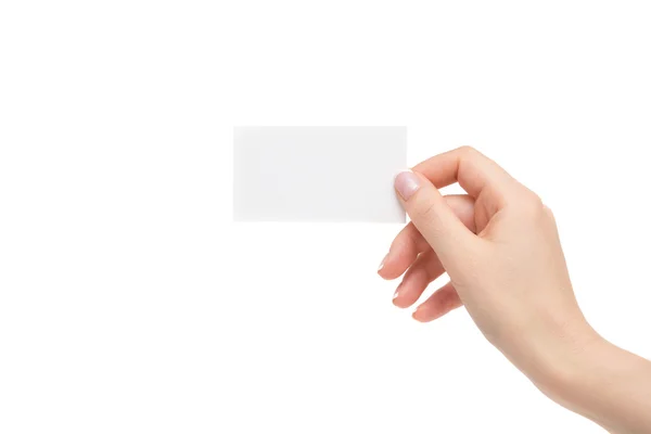 Isolated female hand holds white card on a white background. — Stock Photo, Image