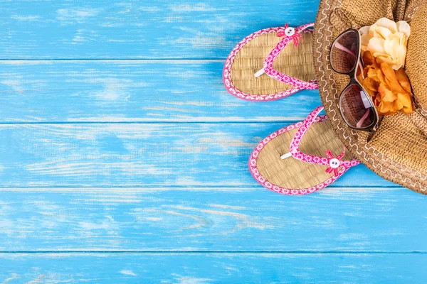 Beach accessories on blue wooden table — Stock Photo, Image