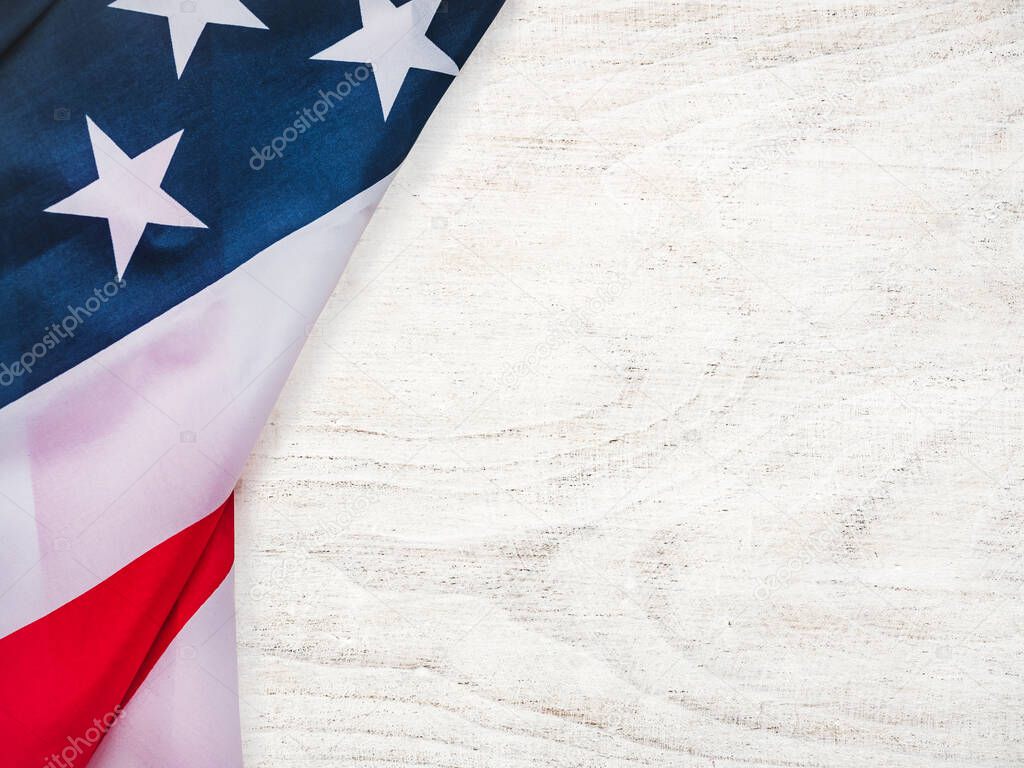 Beautiful greeting card with the American Flag. Textured wood surface. Close-up, view from above. Congratulations for family, relatives, friends and colleagues