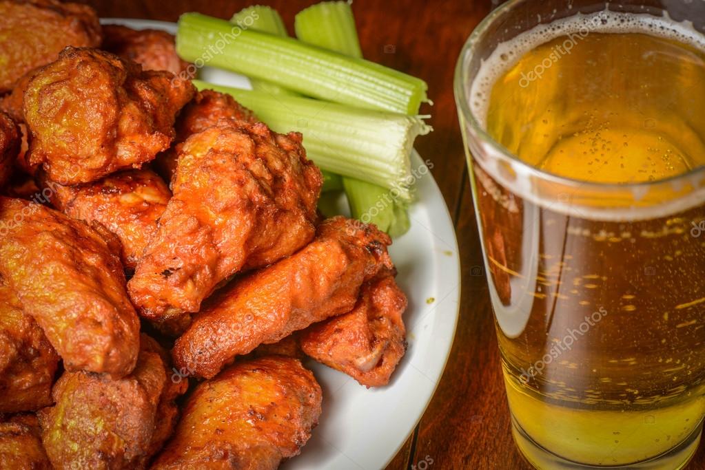 Buffalo Wings with Celery Sticks and Beer — Stock Photo © slickspics